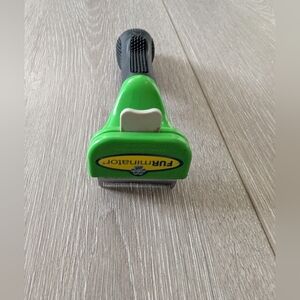 FURminator Black and Green Grooming Tool